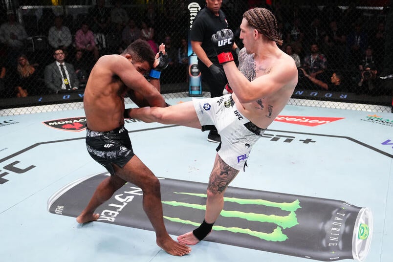 Brendan Allen fires a kick in Octagon action — file photo