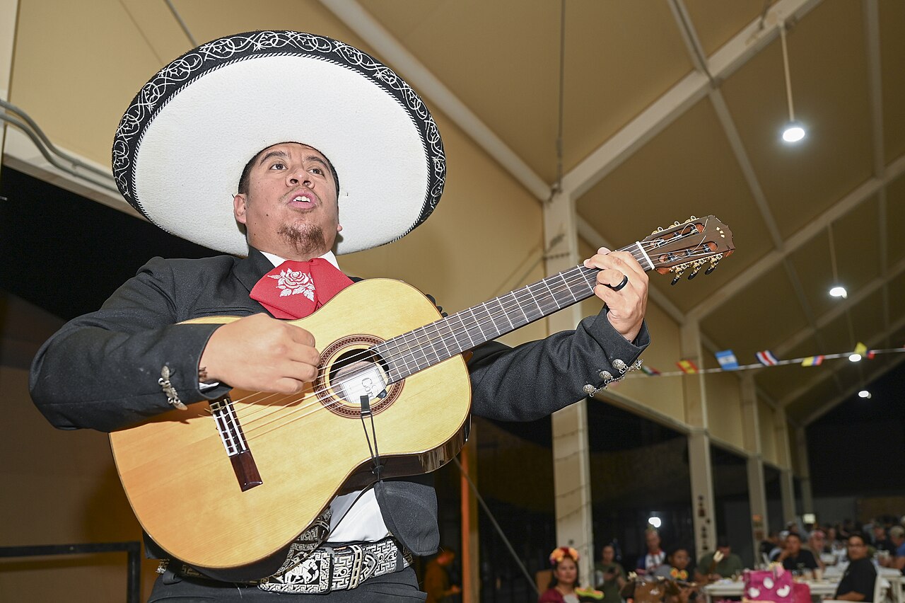 Mariachi musicians performing in traditional charro suits