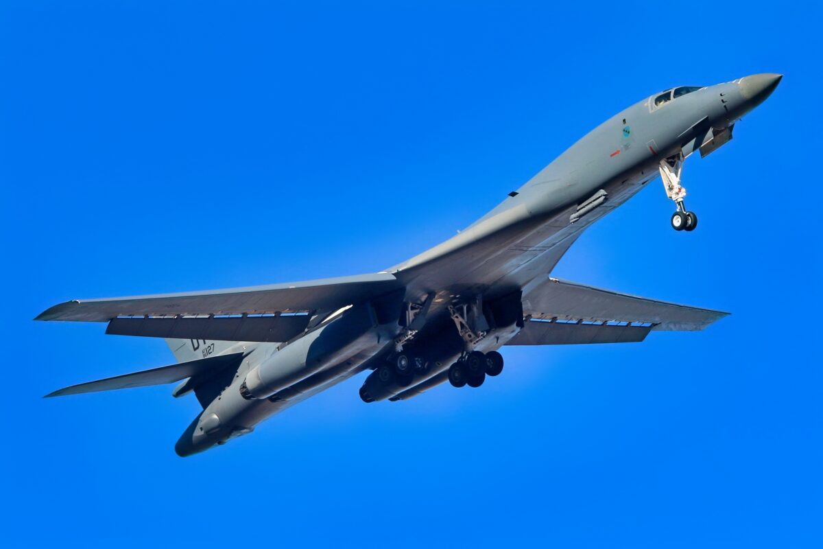A B-1B Lancer bomber in daylight flight over the ocean