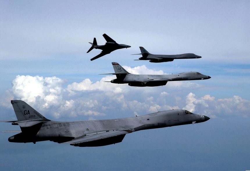 Four B-1B Lancer bombers fly in formation.