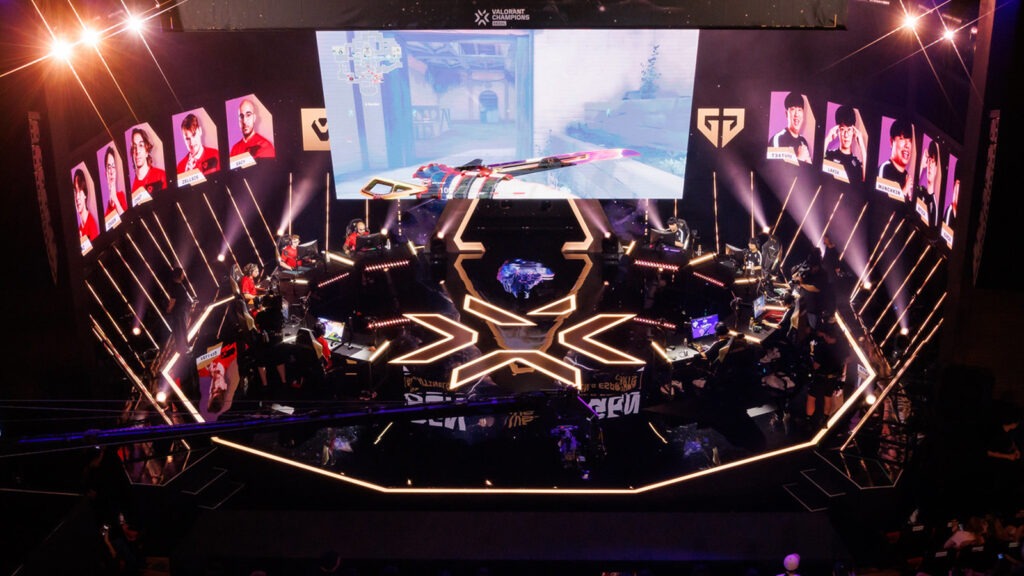 The VALORANT Champions arena stage with the trophy center stage and a packed crowd