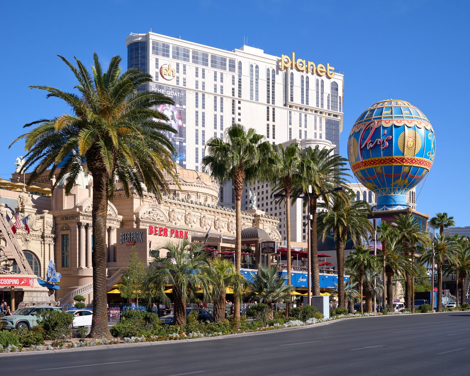The Las Vegas Strip on a bright day, with Planet Hollywood, Paris Las Vegas and Beer Park on Las Vegas Boulevard South.