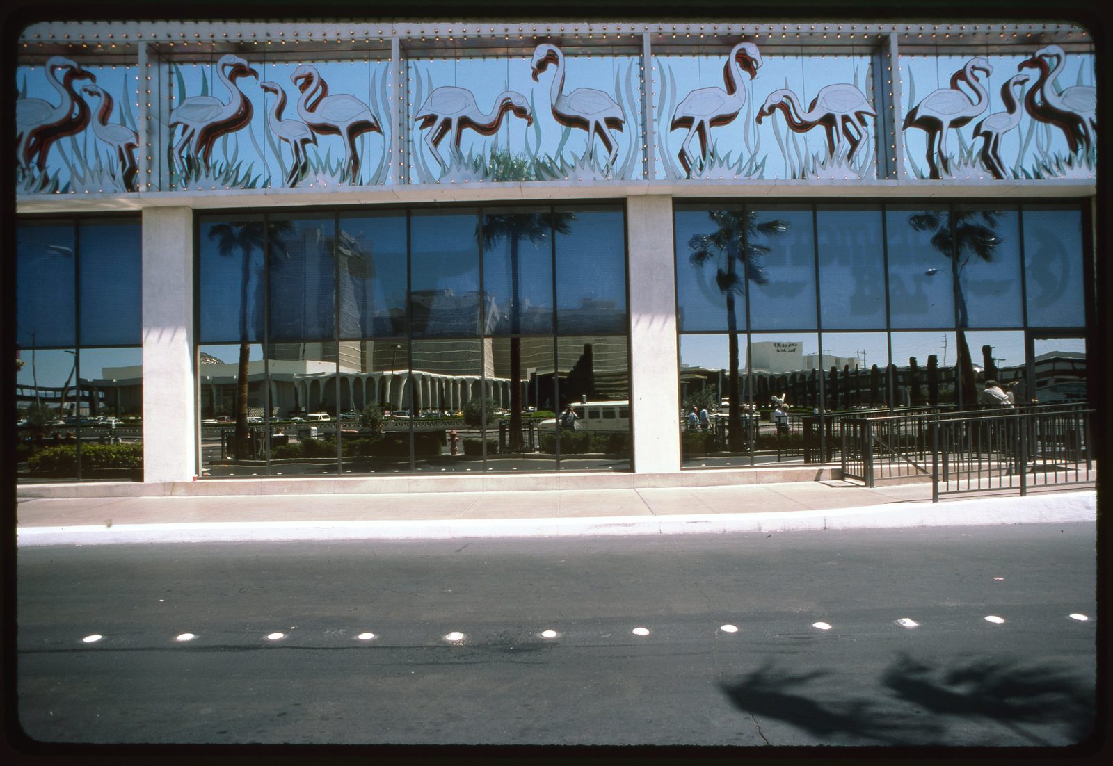 The facade of the Flamingo Hotel on the Las Vegas Strip on a bright day.