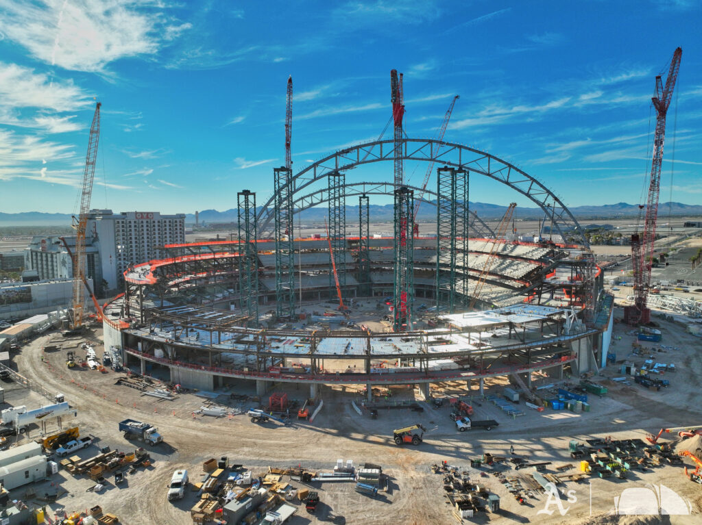 Steel truss arches rising over the Athletics’ Las Vegas ballpark construction site