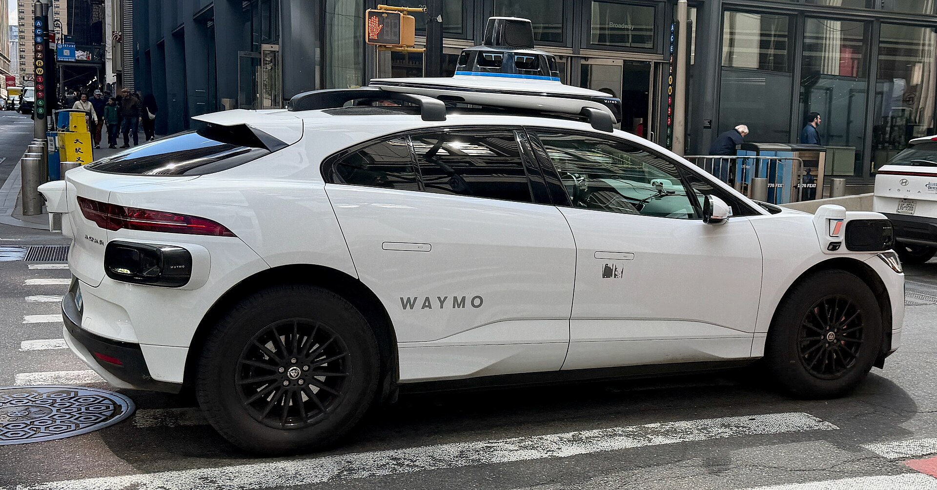 A Waymo Jaguar I-PACE driverless car on a city street, file photo