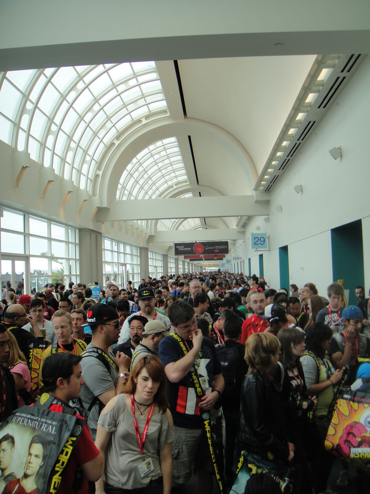 Crowds of fans on the convention floor at a Comic Con
