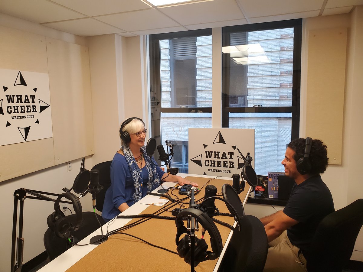 Two podcast hosts recording in a bright studio (file photo)