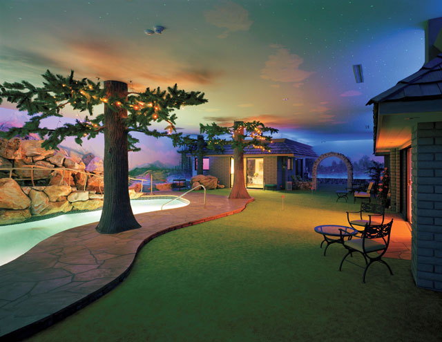 The underground pool at night beneath a starry painted sky