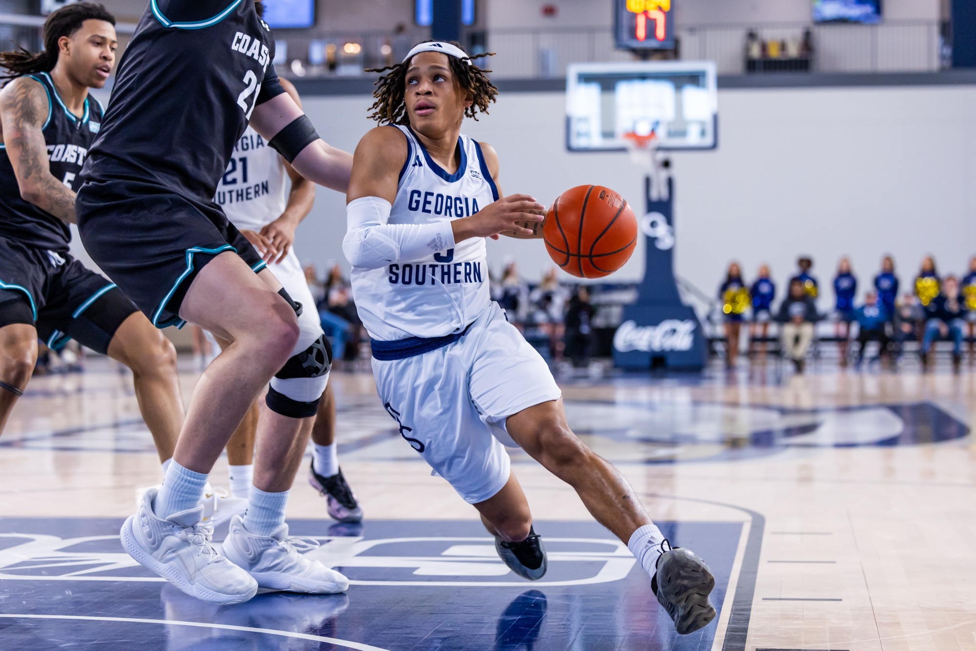 Georgia Southern Eagles guard driving against Coastal Carolina