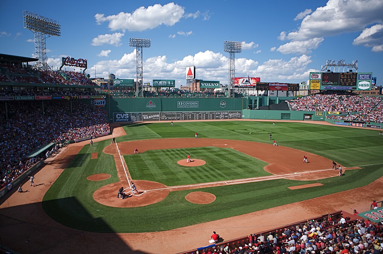 A packed baseball stadium on a bright game day