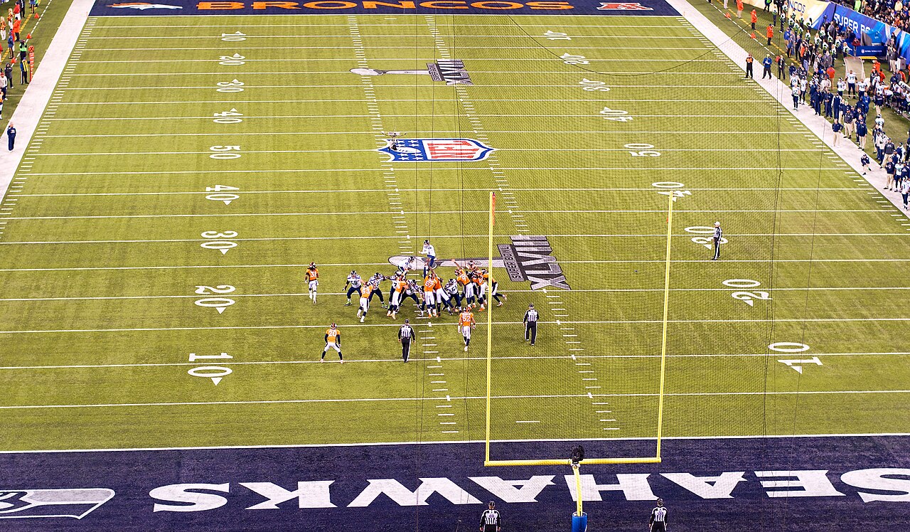 NFL game action on a bright Sunday